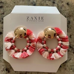 Pink fringe and gold statement earrings.